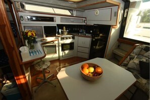 Fridge, microwave, coffee/tea maker, cookware/dishes/utensils