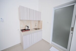 Family Room | Private kitchen | Coffee/tea maker, electric kettle - Cove De Tinaya (Denpasar)