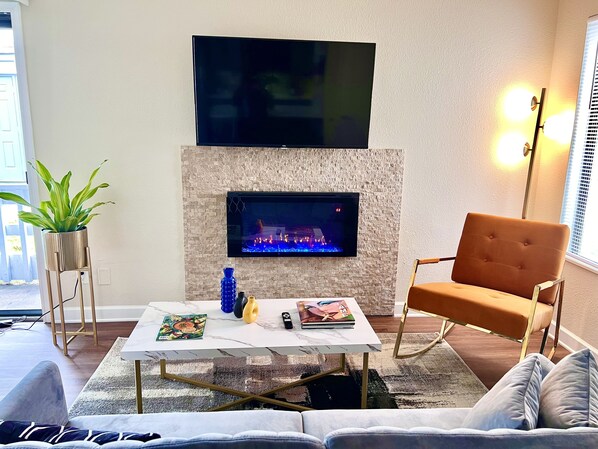 Smart TV, fireplace, books