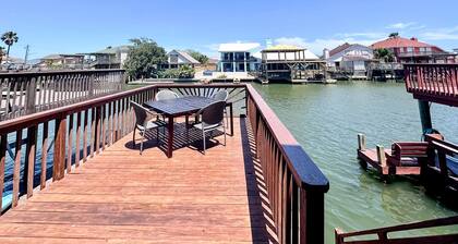 Waterfront townhome with a fireplace, deck, washer/dryer, and central AC