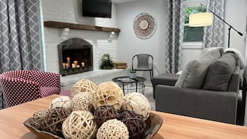 Smart TV, fireplace, books