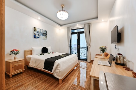 Deluxe Double Room, Balcony | Individually furnished, desk, laptop workspace, blackout drapes