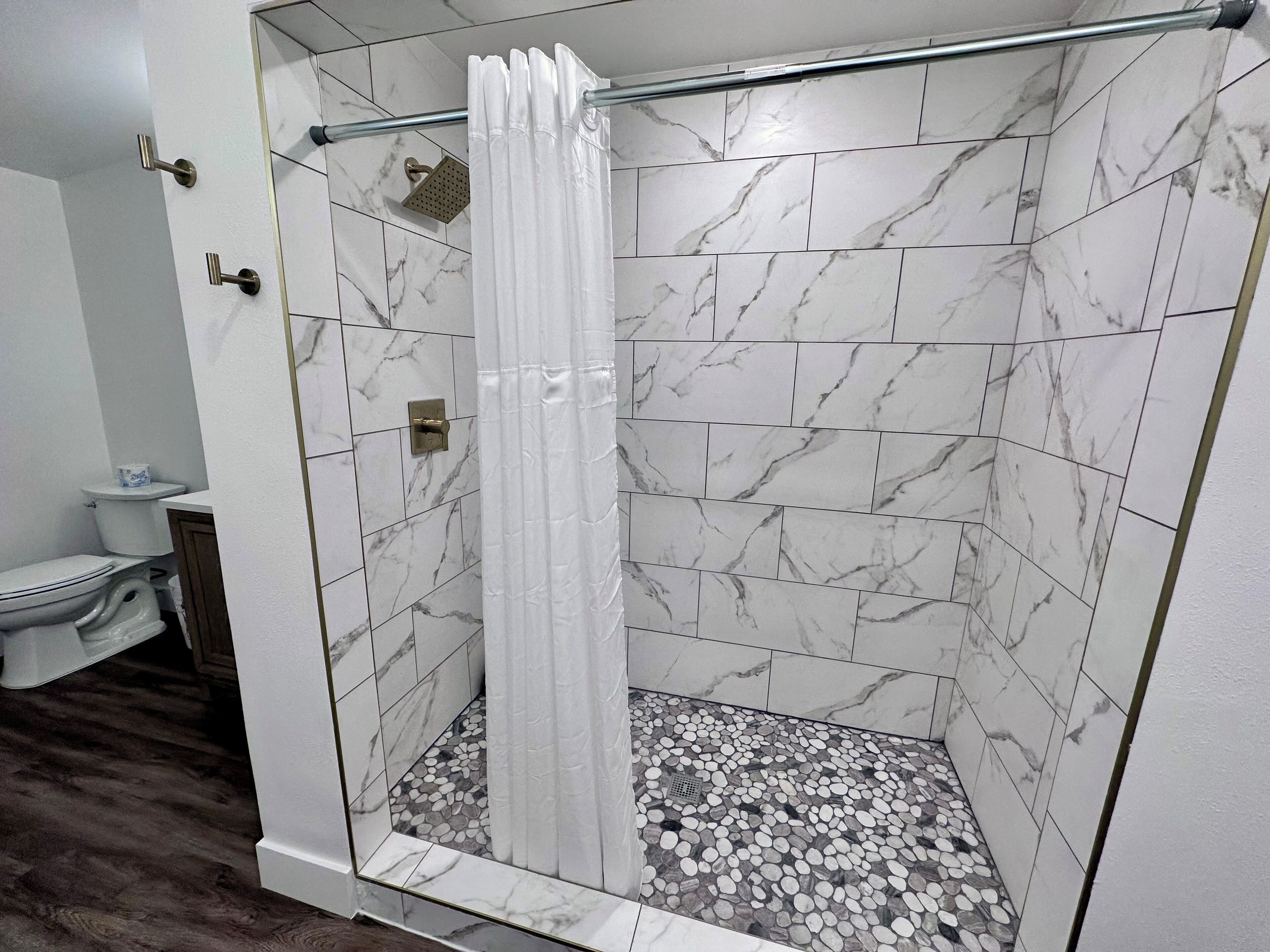 Designer toiletries, hair dryer, towels, soap