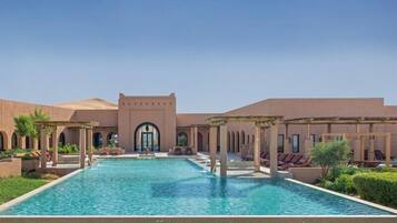Outdoor pool, free cabanas, pool umbrellas