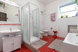 Bathtub, hair dryer, towels