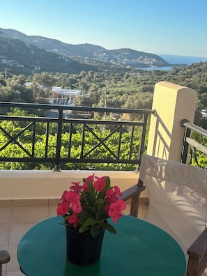 A balcony with a view of a hillside and the sea. - Quiet,sunny villa with nice sea view BBQ and parking space,at vlychada  Bali  (Rethymno)