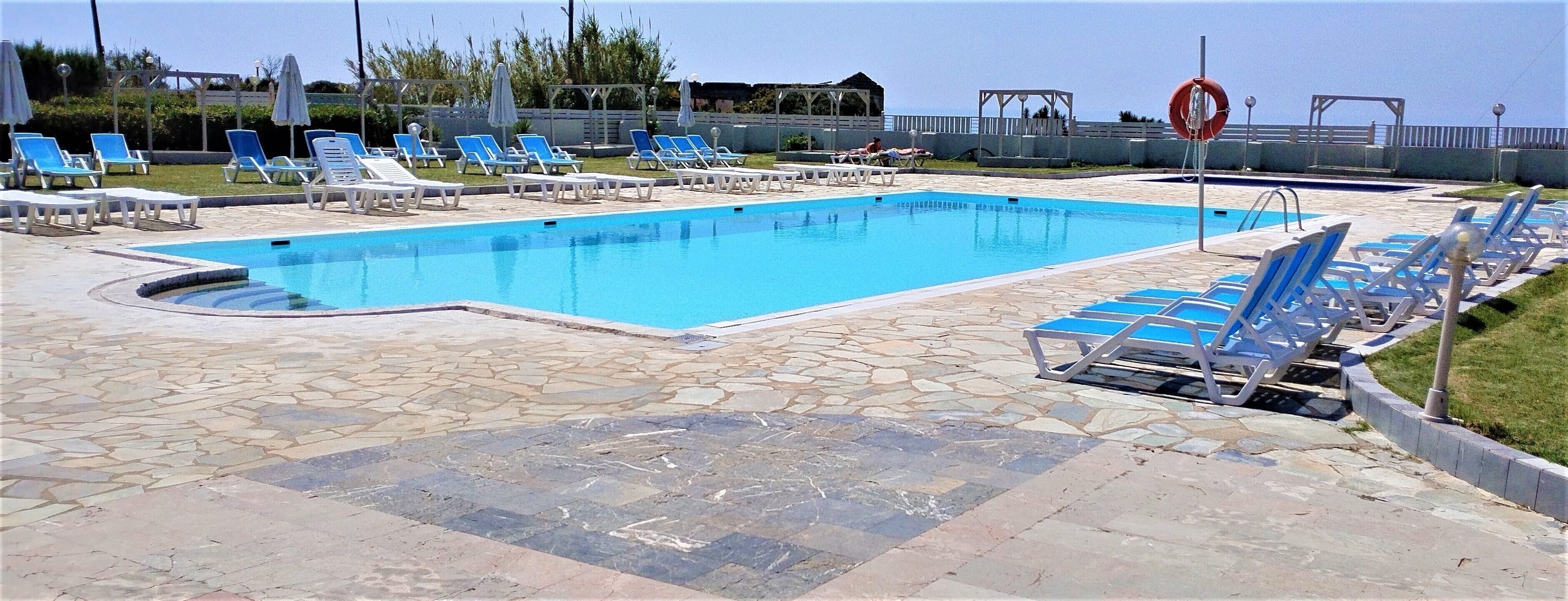 Seasonal outdoor pool, pool umbrellas, sun loungers