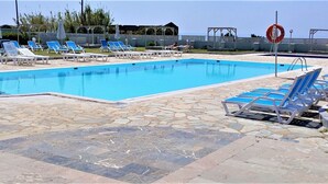 Seasonal outdoor pool, pool umbrellas, sun loungers
