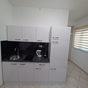 Fridge, coffee/tea maker, electric kettle, toaster