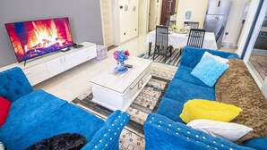 50-inch Smart TV with cable channels, TV, first-run films - Lavington View Palace Apartment (Nairobi)