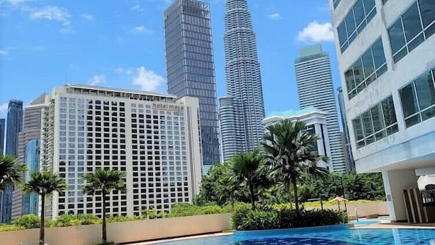 A modern hotel with a swimming pool featuring a geometric tile pattern. - Crest Residence Klcc  (Kuala Lumpur)