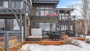 A modern two-story house with a patio area featuring outdoor furniture and a hot tub. - Newpark, Close to ski resorts and restaurants, Amazing Views, Private hot tub (Park City)