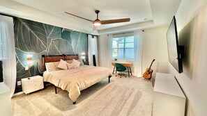 Relax in this cozy retreat with a large bed, desk, and flat-screen TV.