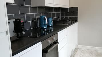 Apartment, 1 King Bed | Private kitchen | Fridge, microwave, oven, stovetop