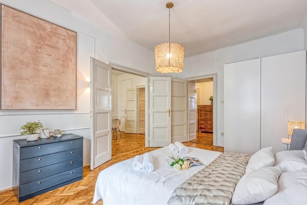 A bedroom with a bed, dresser, and wardrobe. - Spacious Apartment In Heart Of Zagreb (Zagreb)