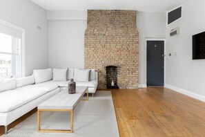 Apartment | Living area | 32-inch flat-screen TV with cable channels, TV - Radiant 2 Bed Flat near Portobello (London)