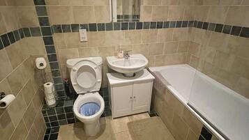 Apartment, 1 King Bed with Sofa bed | Bathroom | Combined shower/tub, deep soaking tub, towels