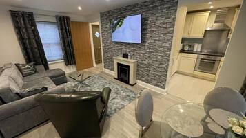 Apartment, 1 King Bed with Sofa bed | Living area | Fireplace