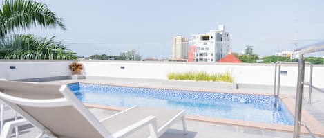 Outdoor pool, open 8:00 AM to 10:00 PM, pool umbrellas, pool loungers