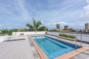 Outdoor pool, open 8:00 AM to 10:00 PM, pool umbrellas, pool loungers