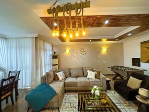 City Apartment, 2 Bedrooms, City View | Living area | 55-inch Smart TV with cable channels, TV, Netflix