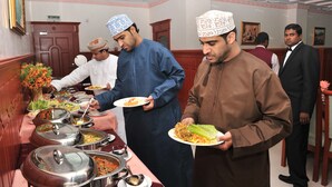 A buffet setup with various food dishes and serving utensils. - Manam Sohar Hotel Apartments (Sohar)