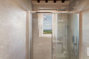 Villa | Bathroom | Shower, rainfall showerhead, hair dryer, bidet