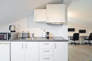 Fridge, microwave, stovetop, coffee/tea maker
