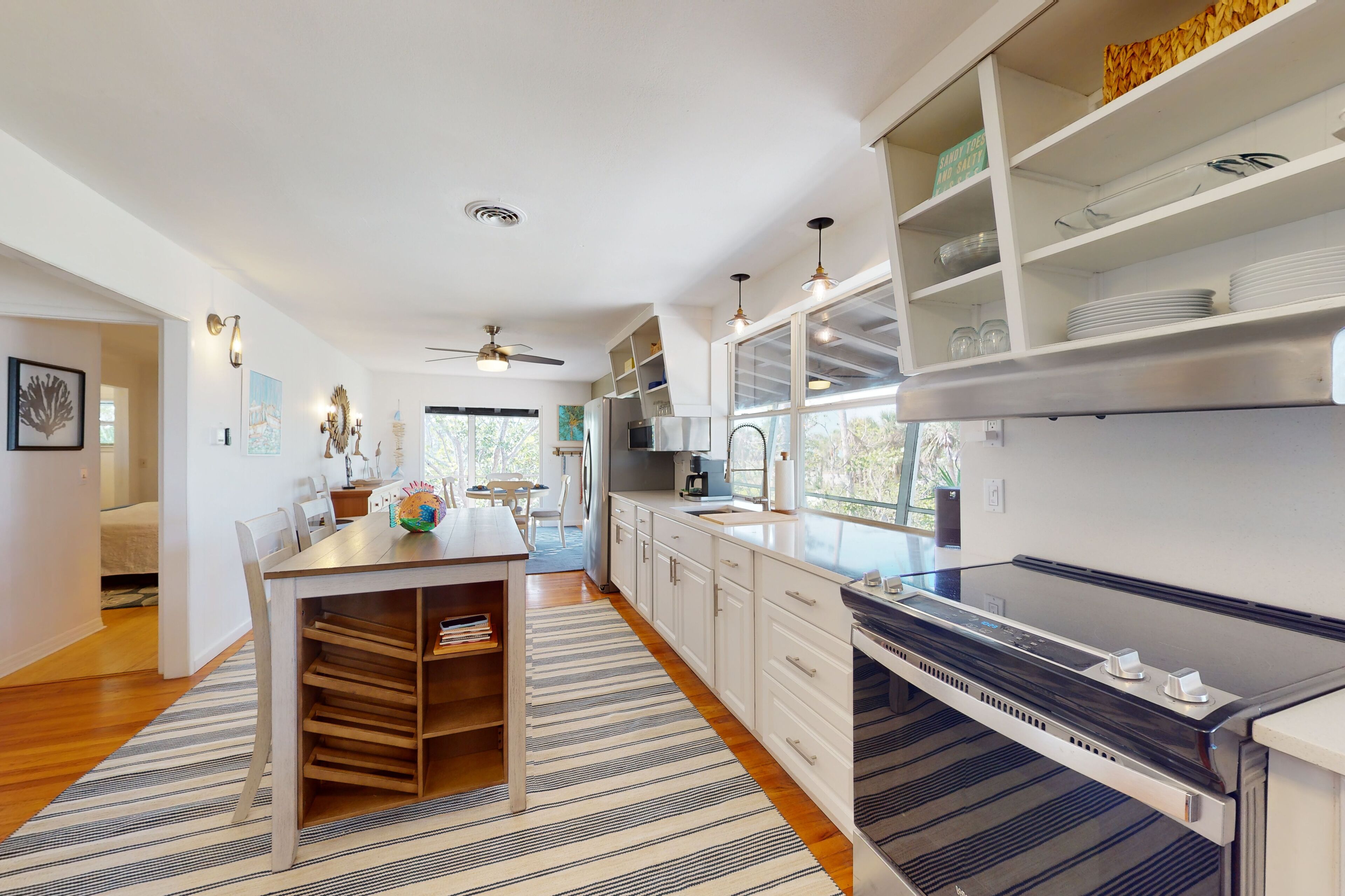 Tropical Palm Island home steps from the beach with grill, outdoor shower, dock