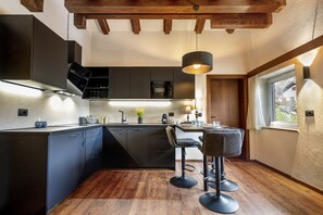 Fridge, coffee/tea maker, cookware/dishes/utensils