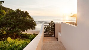 A modern building with a view of the ocean. - Brand New Beach front 5 bedroom house steps from the beach  (San Juan del Sur)