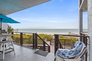 Outdoor dining - The Gulf Front- 2 bed beachfront condo with incredible views-Brand new renovated (Holmes Beach)