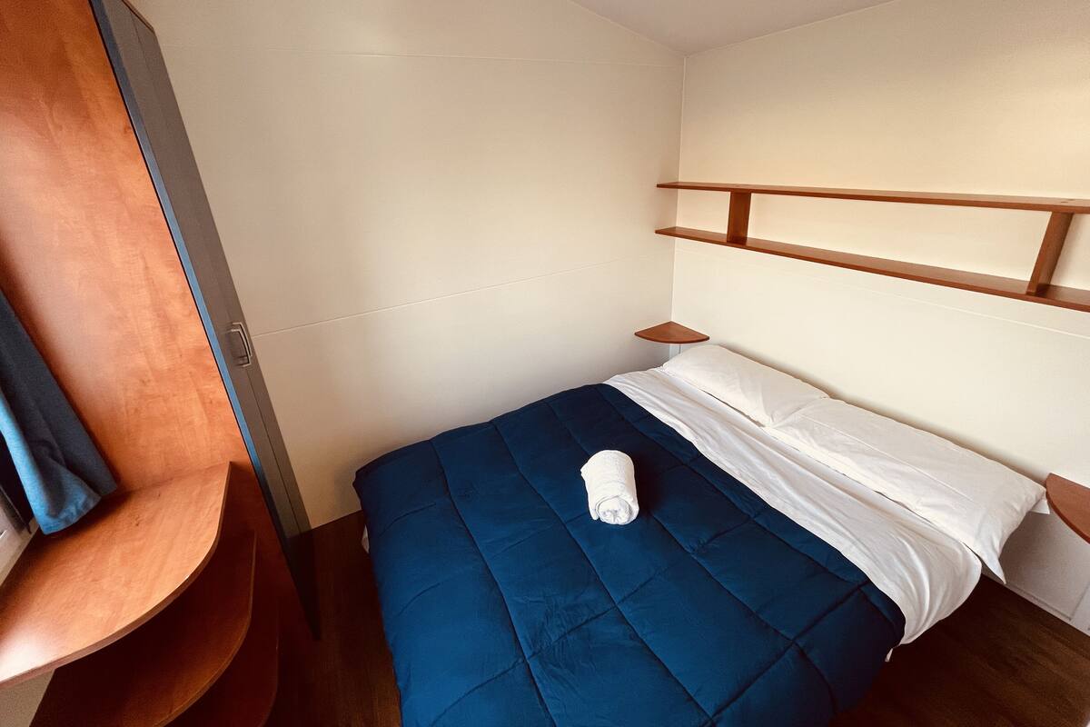 Basic Mobile Home | Laptop workspace, bed sheets