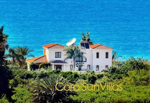 Enjoy breathtaking sea views from this villa, set amidst lush green surroundings.