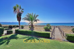 Stroll along the beautifully landscaped pathway to the nearby beach.