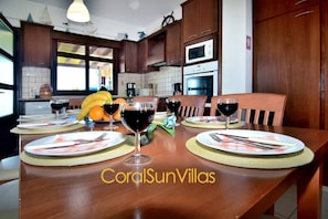 Enjoy meals in the hotel's dining area, set with a table for four and equipped with a microwave.