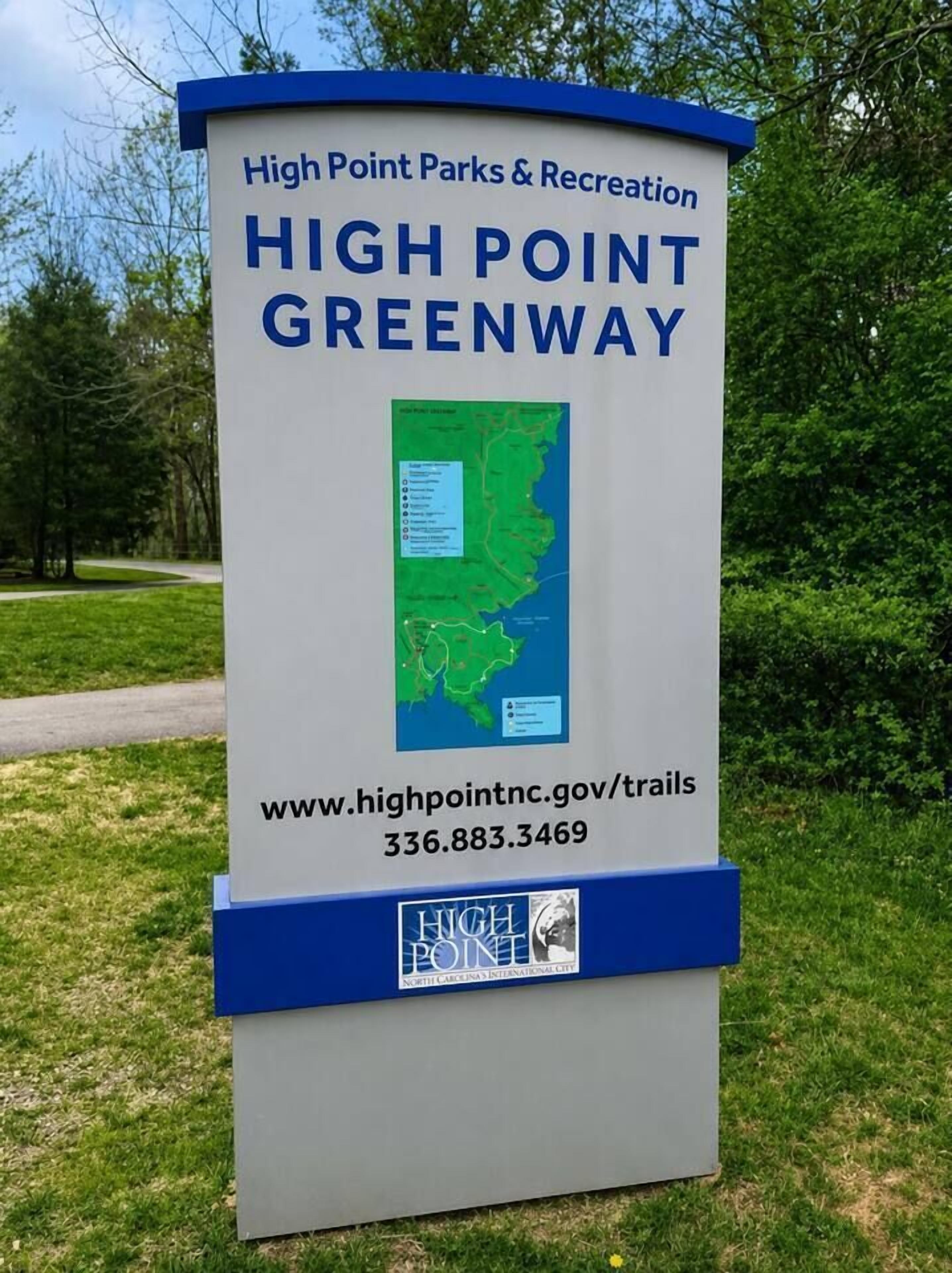 A sign for High Point Parks & Recreation with a map and contact information.