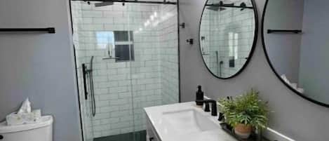 Shower, hair dryer, towels, soap