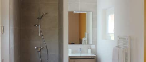 Shower, hair dryer, towels, toilet paper