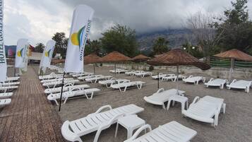Private beach, white sand, free beach cabanas, sun loungers