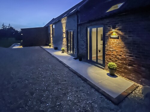 Exposed beams and calming green colours for this holiday home.