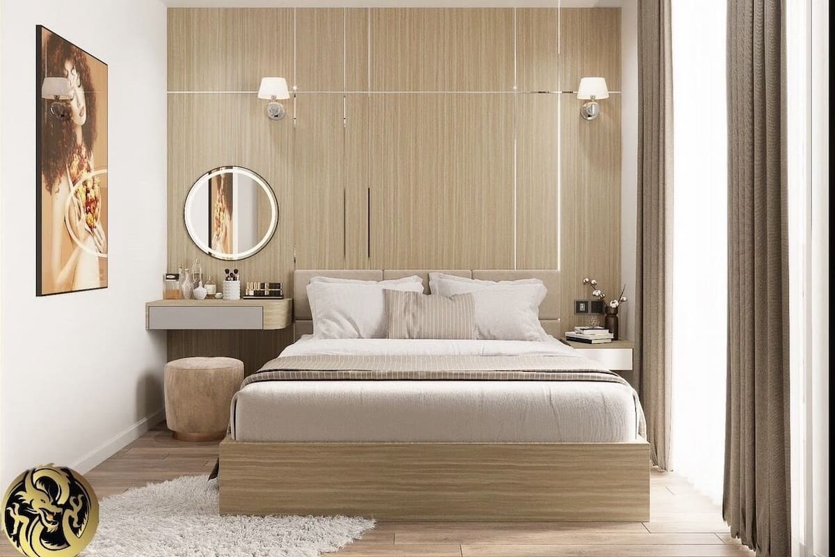 A modern bedroom with a large bed, bedside tables, a round mirror, and a wall-mounted light fixture.