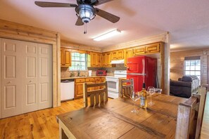 Enjoy cooking in this well-equipped kitchen with a central island and adjacent dining area.