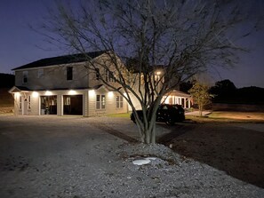 Stunning two-story home with a cozy front porch and a driveway.