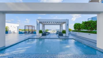 Outdoor pool, open 7:30 AM to 6:30 PM, free cabanas, pool umbrellas