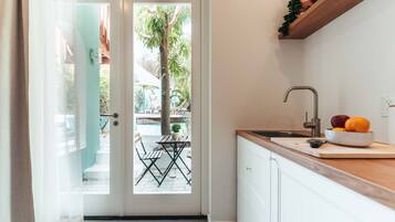 Full-sized fridge, coffee/tea maker, coffee grinder, paper towels
