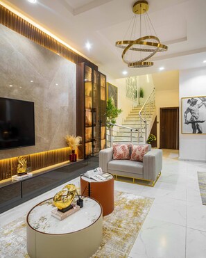 Luxury Duplex | Living room | 65-inch Smart TV with cable channels, TV, Netflix