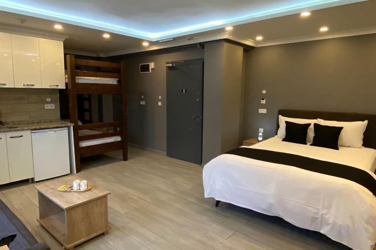 Premium bedding, desk, laptop workspace, soundproofing
