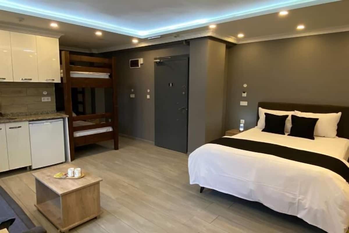 Premium bedding, desk, laptop workspace, soundproofing