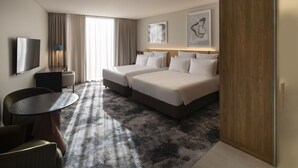 A hotel room with two beds, a TV, a desk, and a chair. - Pullman Sydney Penrith (Penrith)